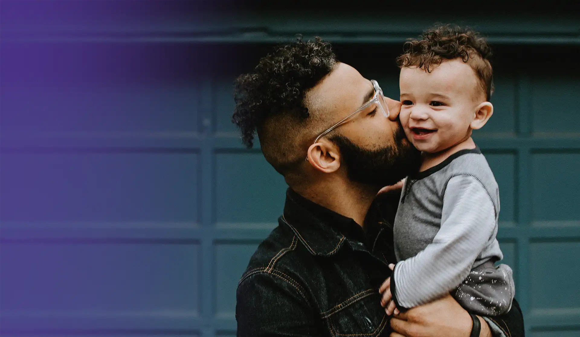 Young father kissing his son on the cheek. Both are benefitting from New Jersey Recovery and Family Support from Prevention Links.