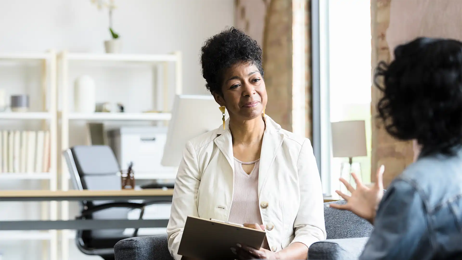 therapist listening to a patient during talk therapy