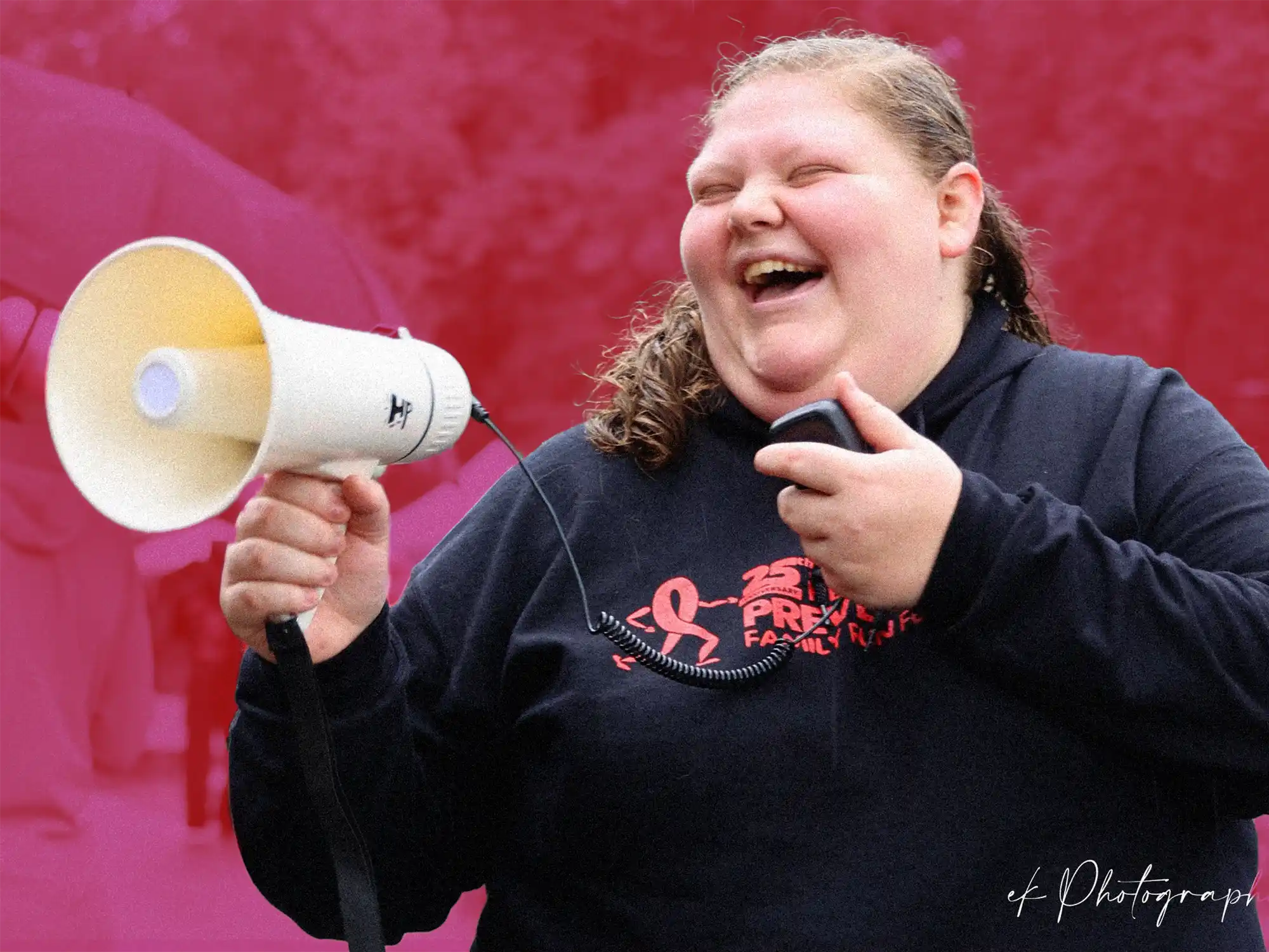 Emily with a bullhorn at Red Ribbon Day reducing stigma for drug misuse and recovery