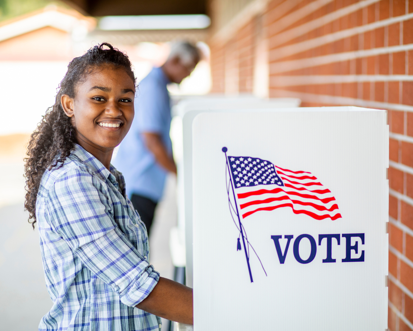 Woman at a voting booth