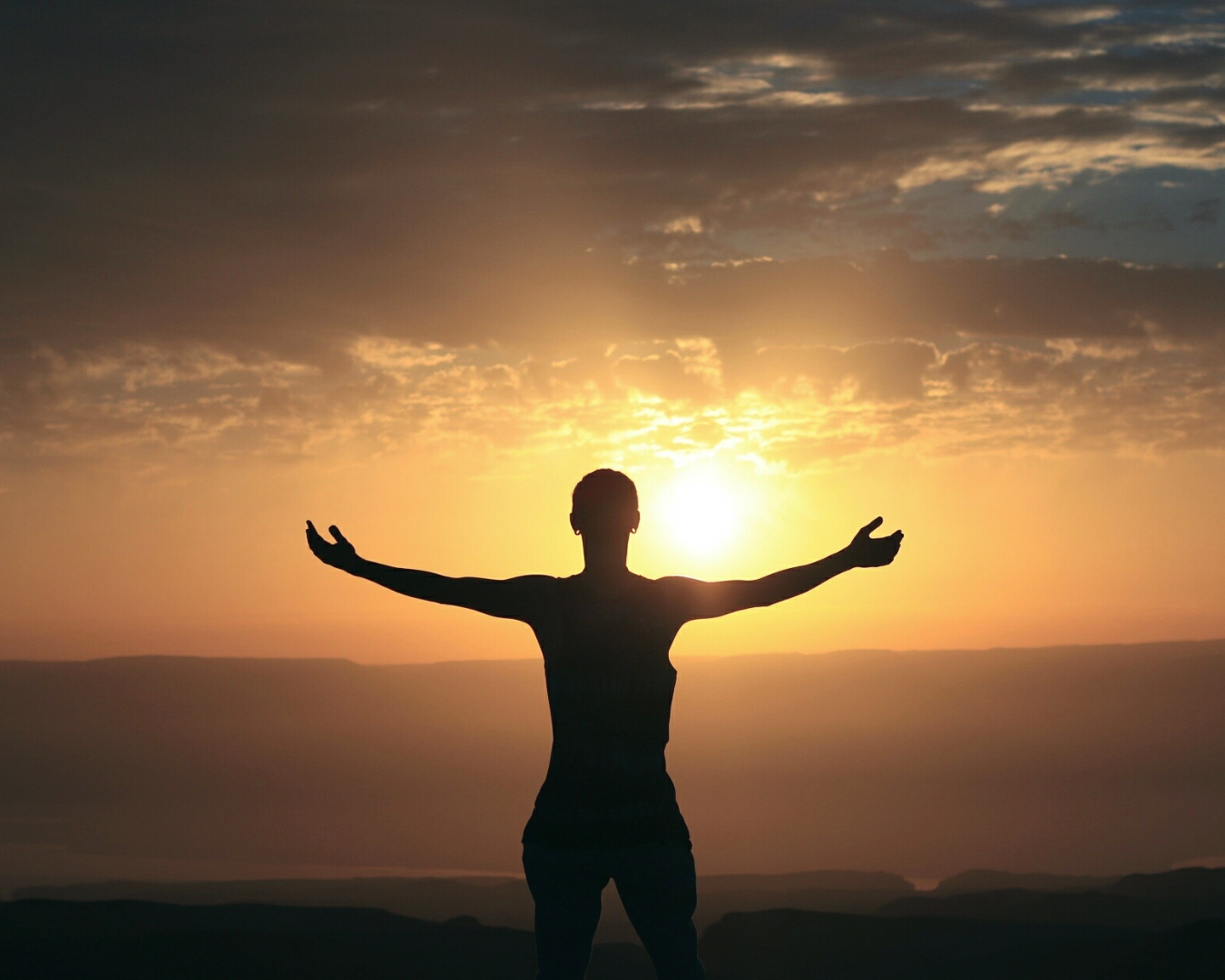 person with arms outstretched