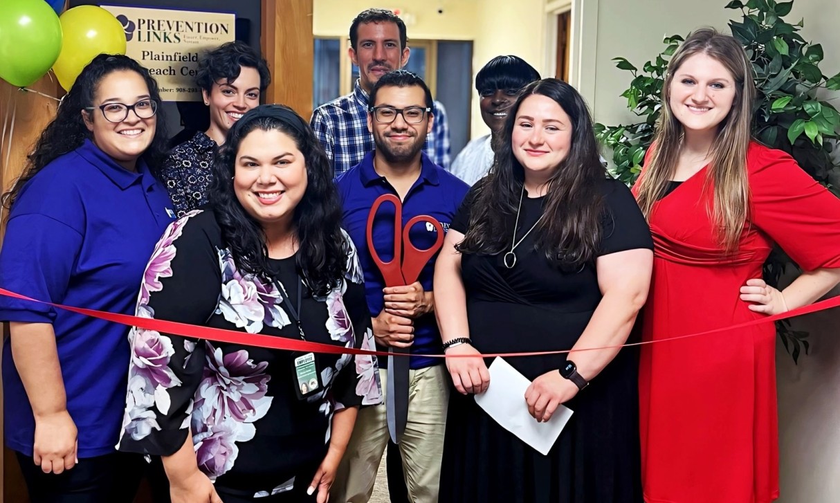 People gathered at door for ribbon cutting Rise Up Community Center in Plainfield